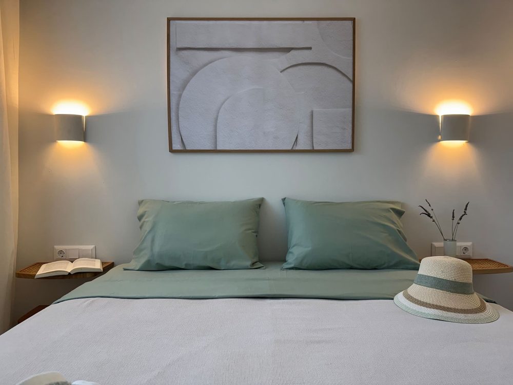 House II green-accented bedroom