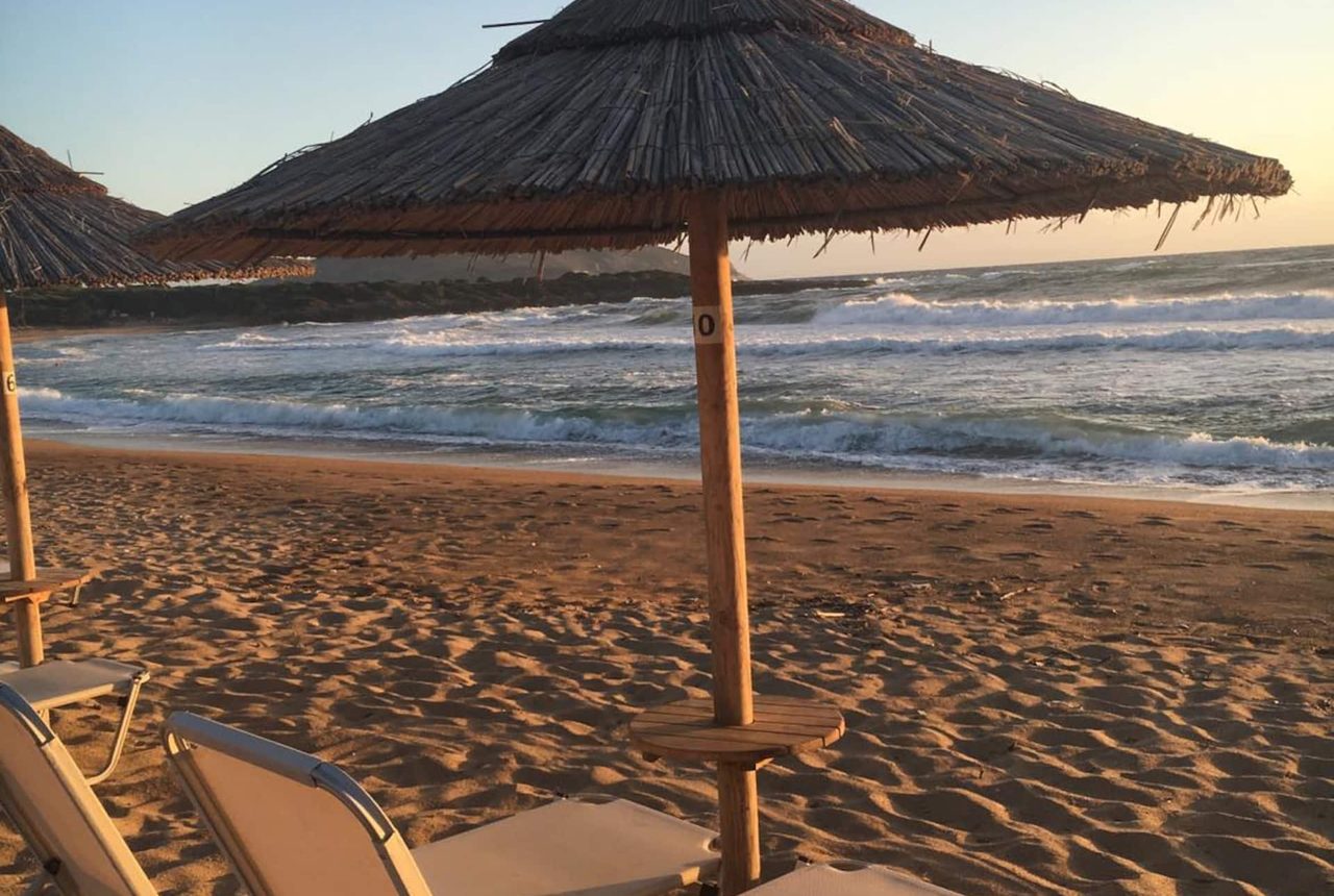The sandy beach at Lagouvardos, a few steps from both houses